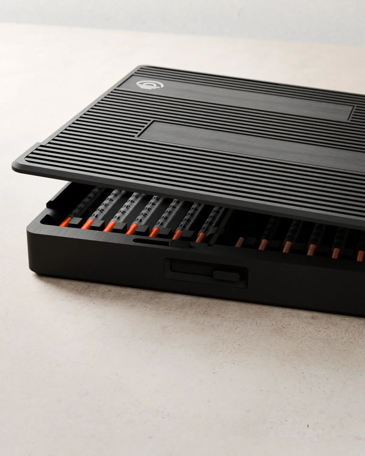 Close view of the Routine Box textured lid lifting over the loaded tray